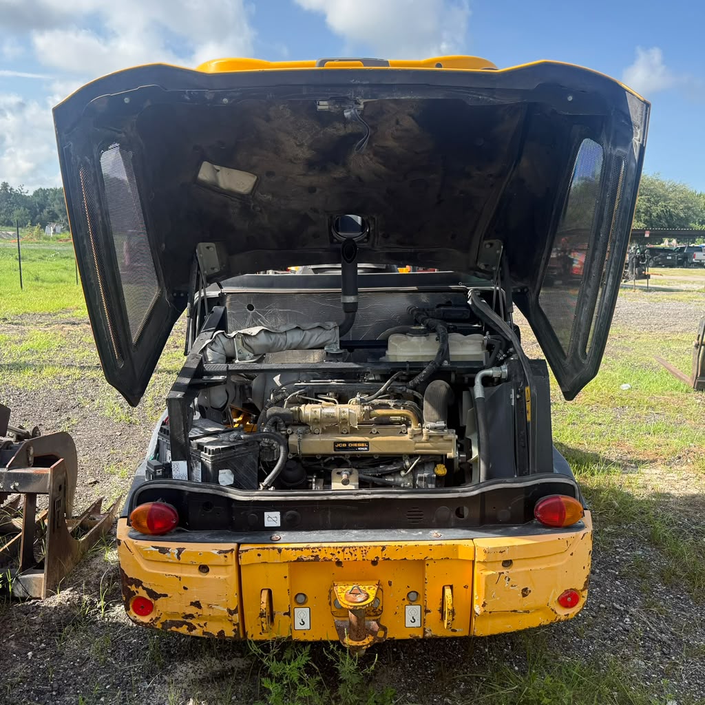 Work machine with the engine hood raised for diesel service at A3 Mechanic in Apopka, FL